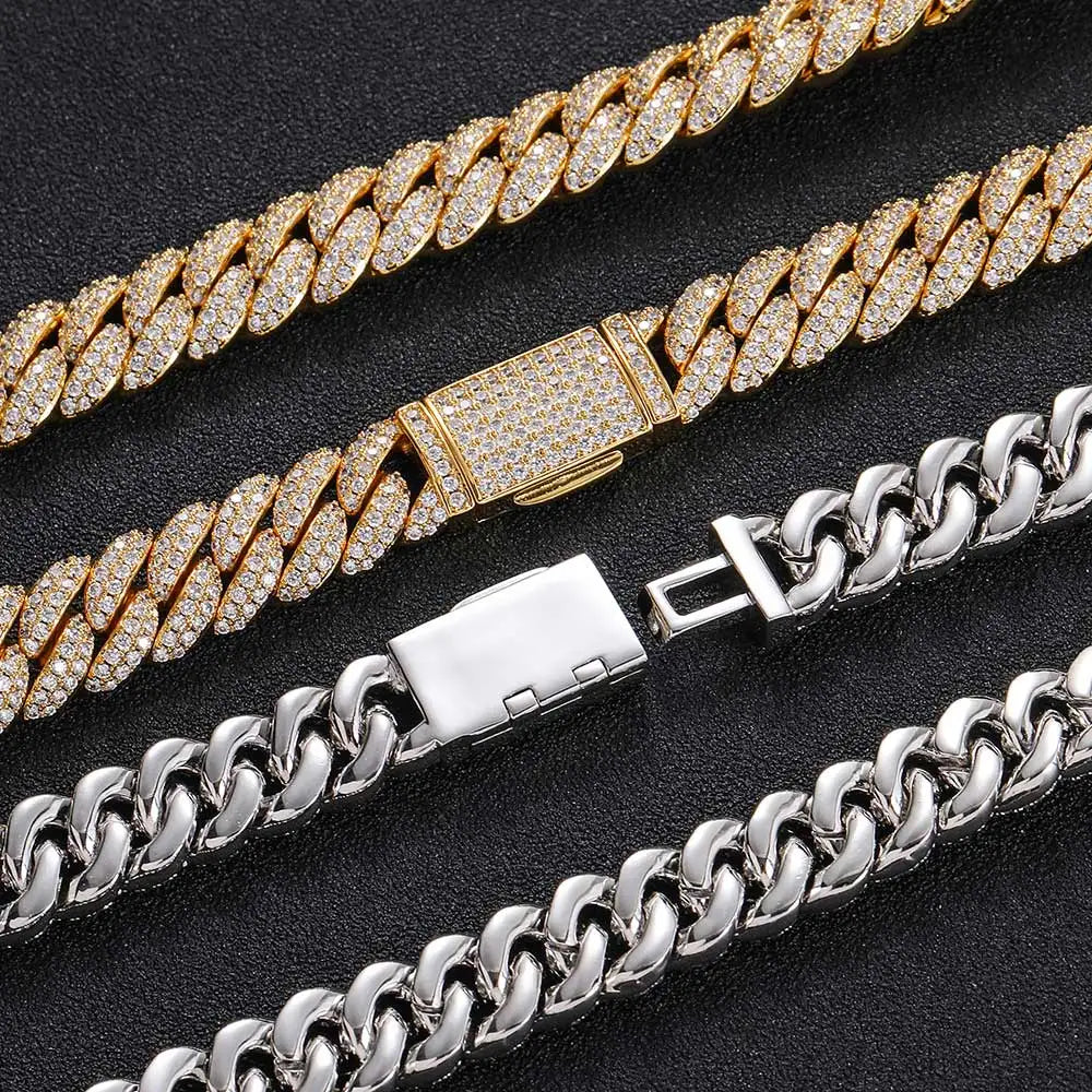 Silver and gold Iced out Cuban chains line up next to each other