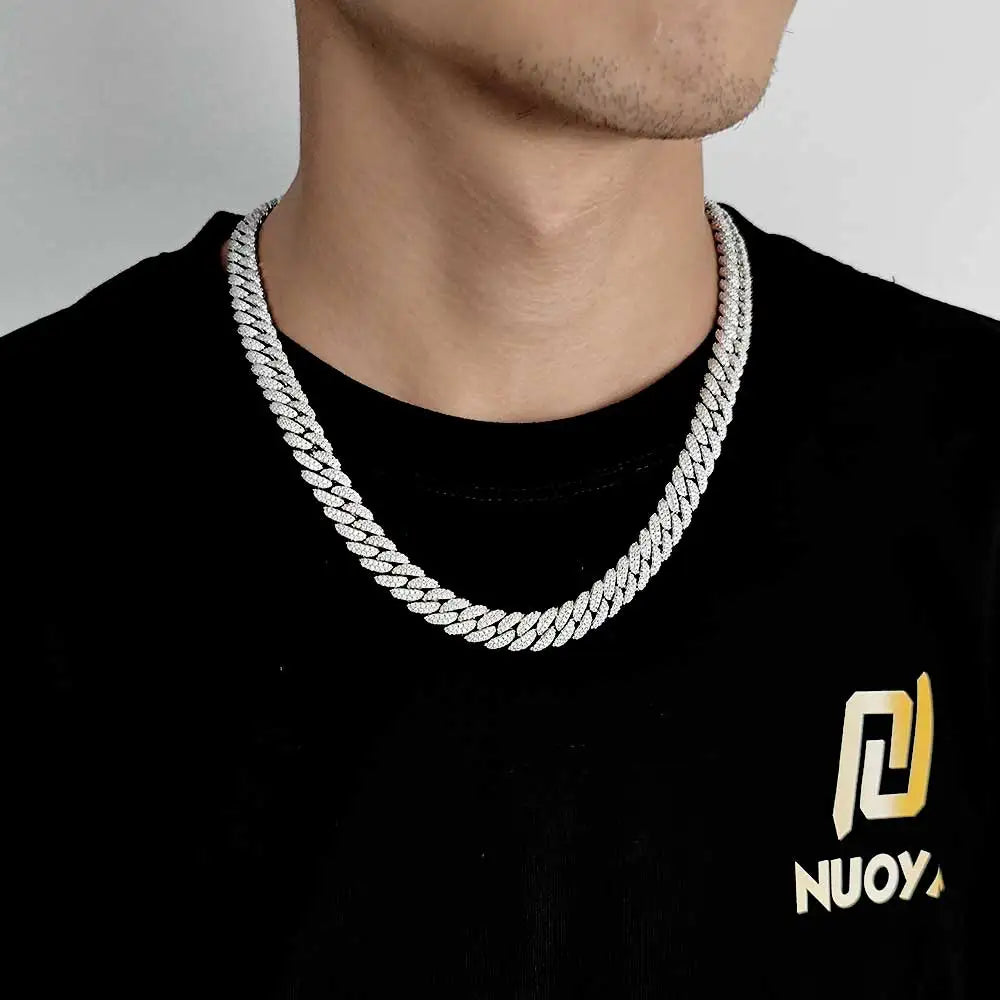 Silver Iced out Cuban chain on mans neck