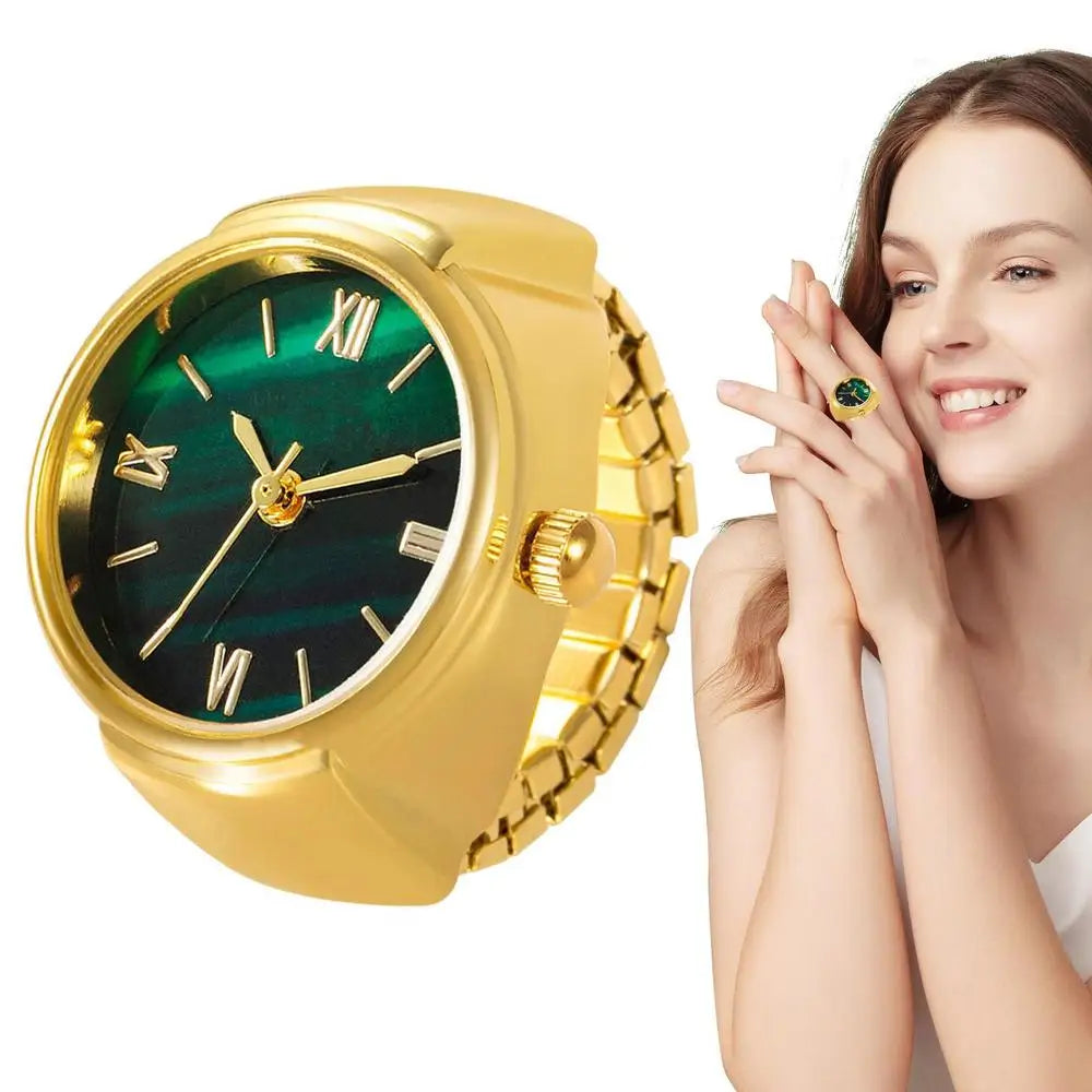 gold and green finger punk watch ring close up with woman wearing it brown hair