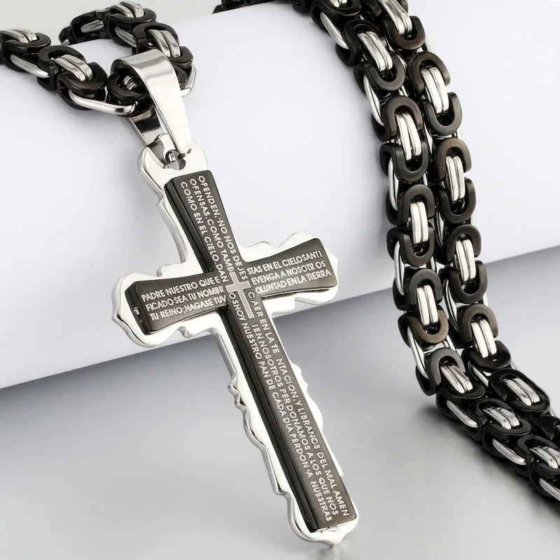 Black and silver cross and chain displayed on jewelry stand