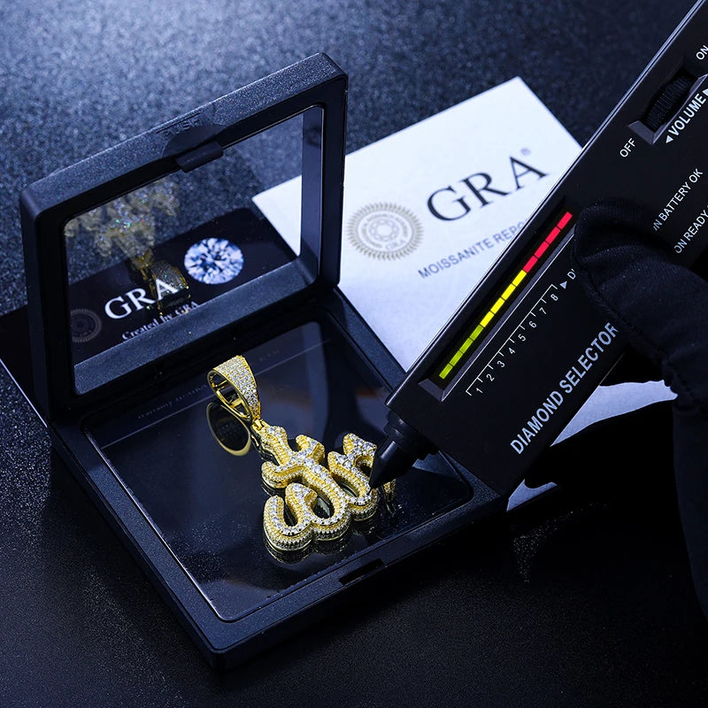 Gold Moissanite rune pendent in display box being tested