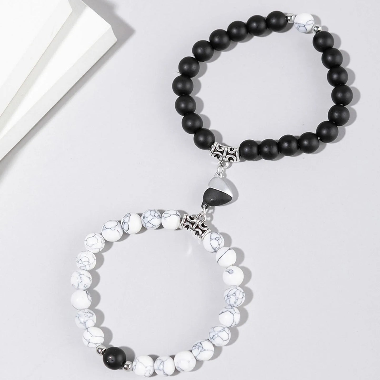 White cut black bracelet