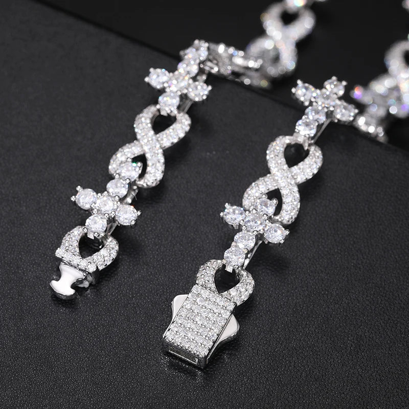 Moissanite crosses chain double lined diagonal on jewelry display  