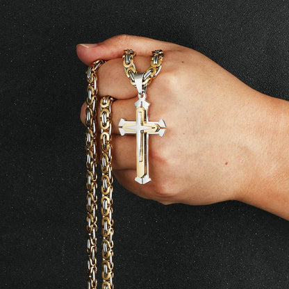 Silver and gold chain held up in hand