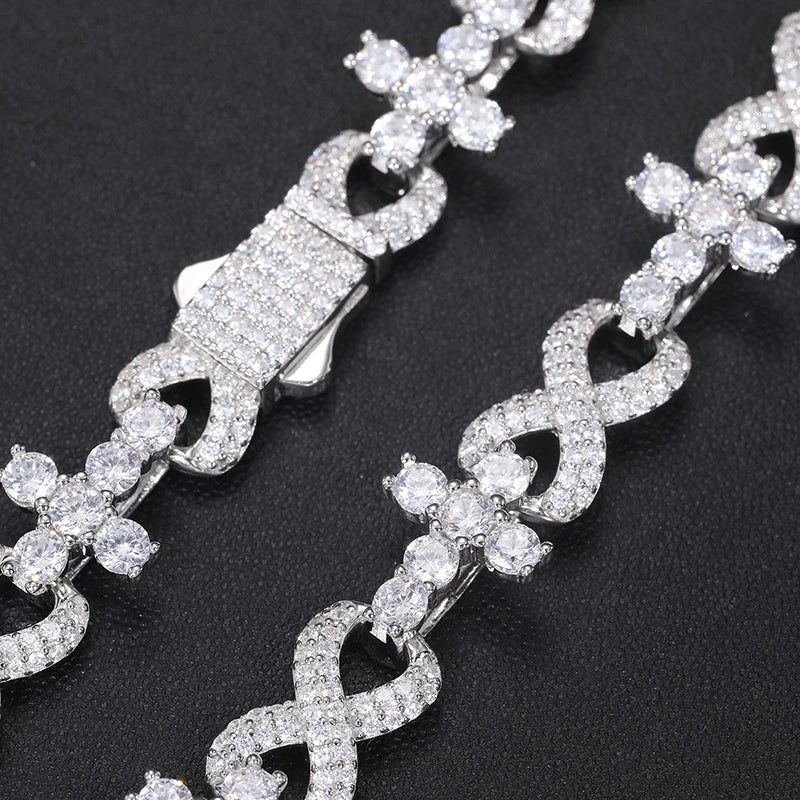 Moissanite crosses chain double lined diagonal on jewelry display clasped together 