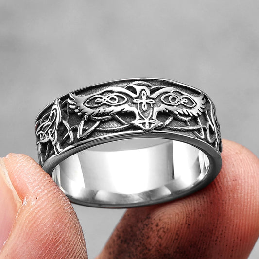 Phoenix Totem Ring Stainless Steel held between two fingers front view
