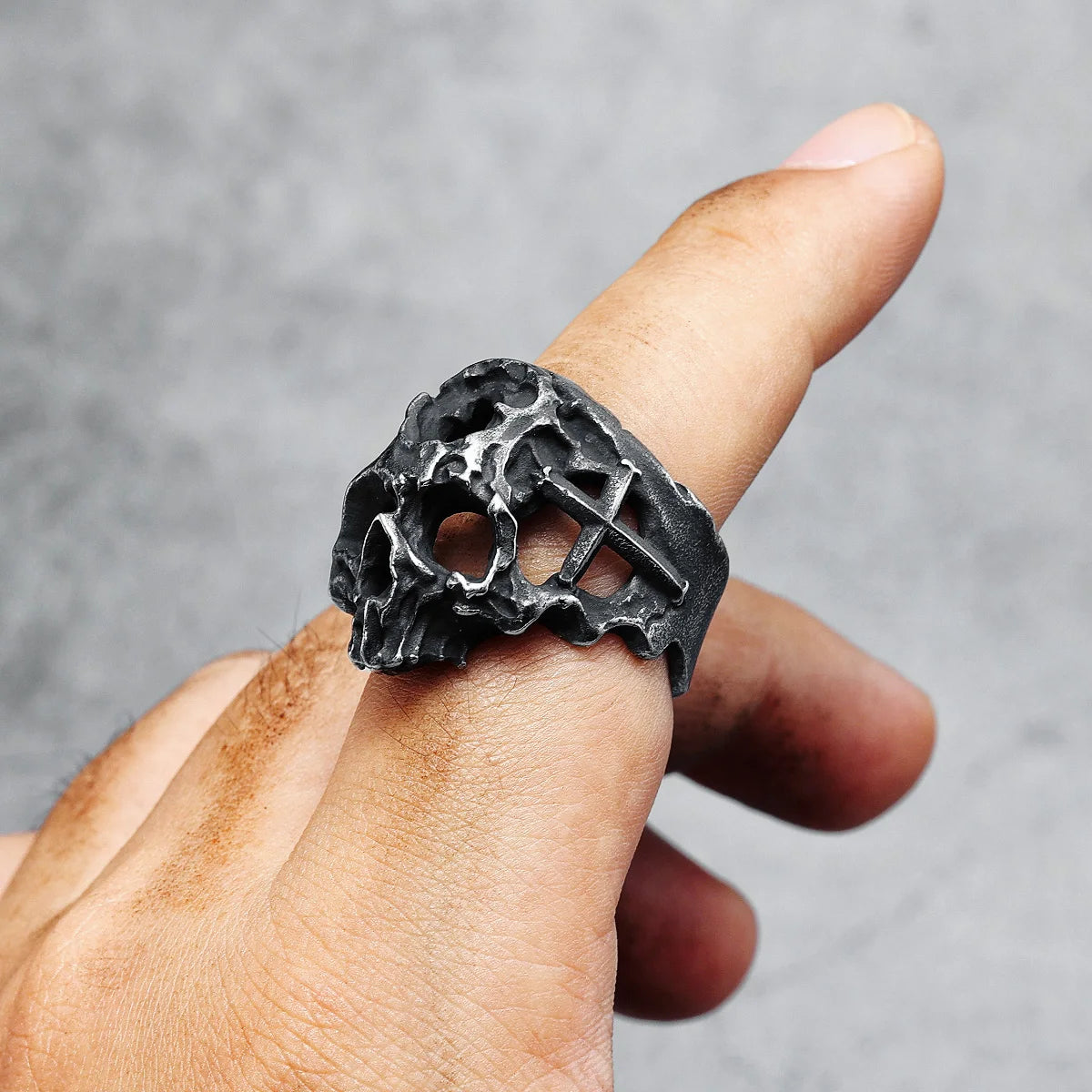 Hollow Skull Ring top view on index finger, side view 